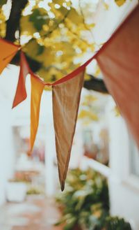 Close-up of bunting flags hanging outdoors