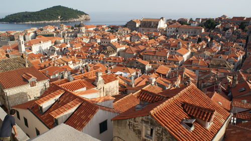 High angle view of houses in town against sky