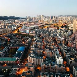 High angle view of city buildings against sky