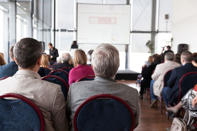 Rear view of people in seminar