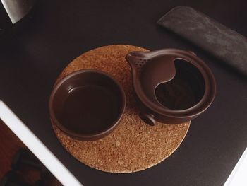 High angle view of coffee cup on table