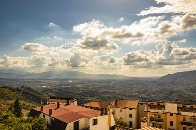 Aerial view of townscape against sky