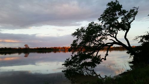 Scenic view of lake against cloudy sky