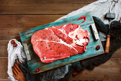 High angle view of meat on cutting board