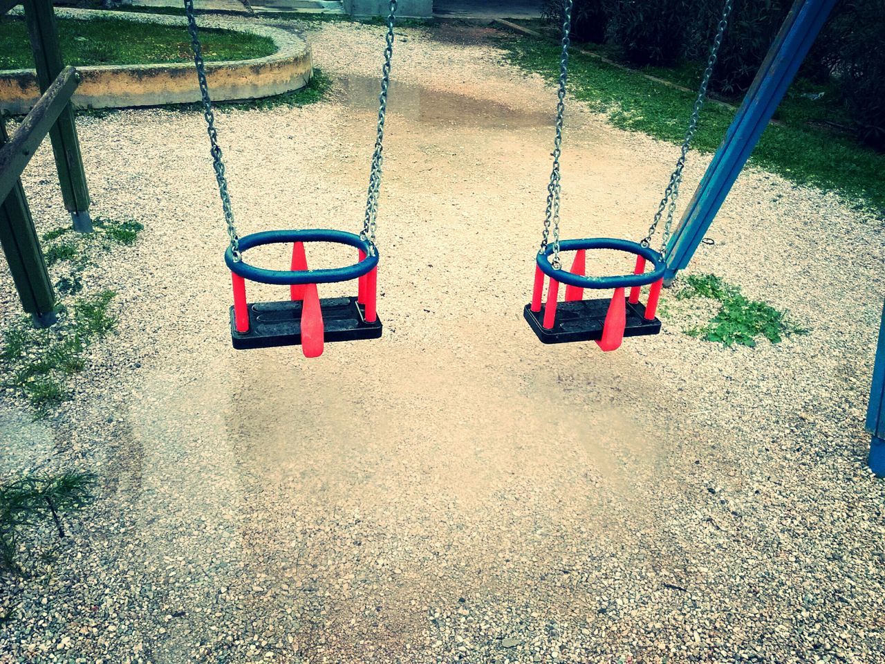 red, absence, empty, high angle view, shadow, sunlight, street, chair, day, cobblestone, paving stone, footpath, playground, seat, no people, outdoors, sidewalk, protection, metal, safety