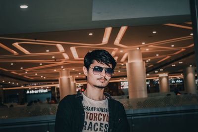 Portrait of young man wearing sunglasses