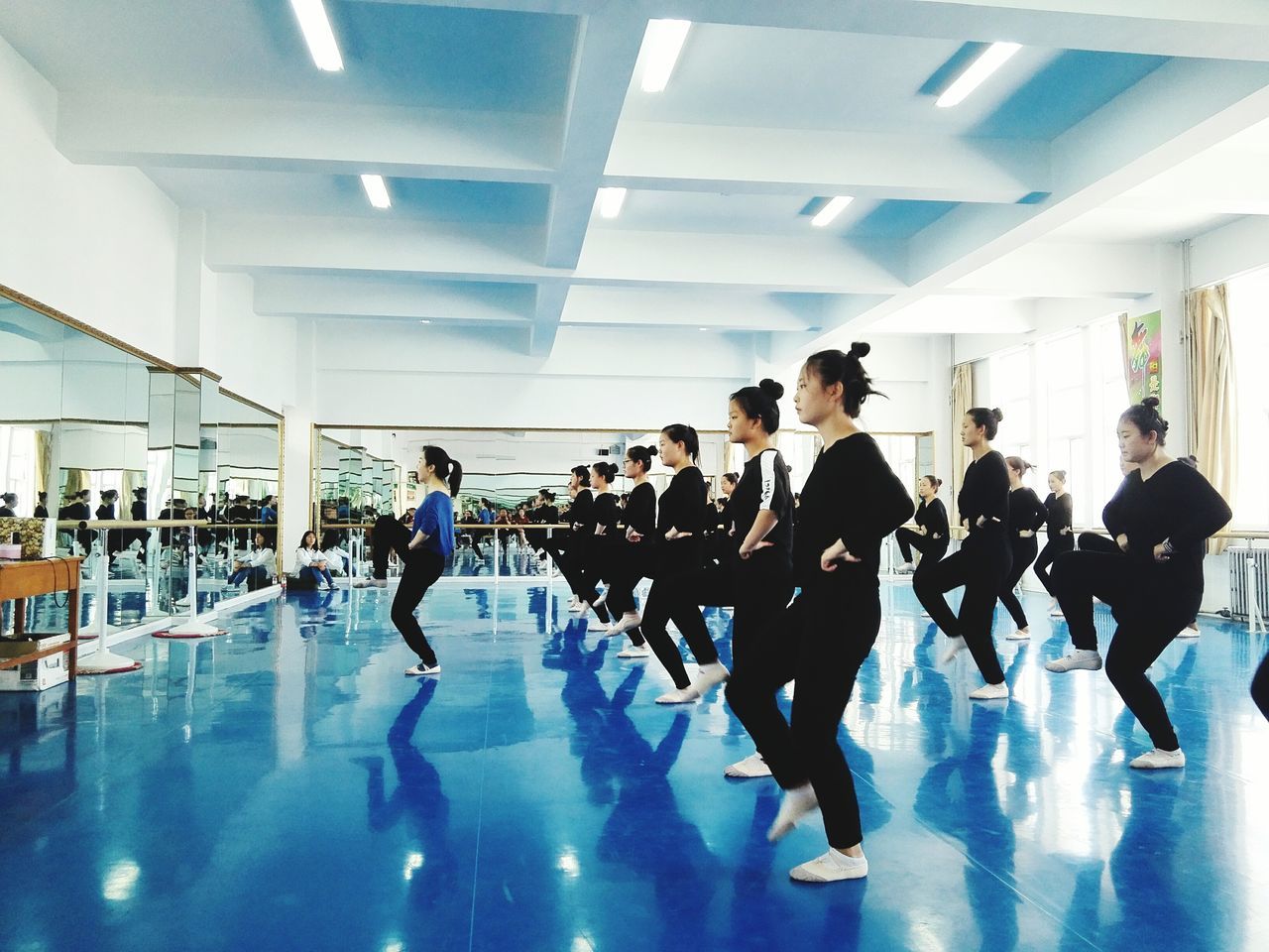 group of people, real people, indoors, men, large group of people, flooring, women, architecture, motion, crowd, adult, reflection, arcade, corridor, lifestyles, walking, illuminated, day, ceiling, luxury