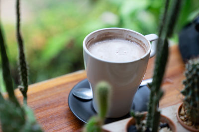 Close-up of coffee cup on table