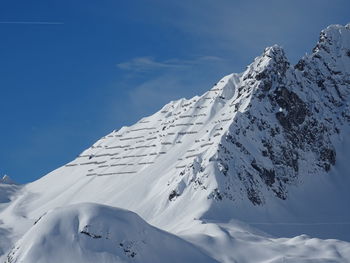 Snow covered mountain against sky