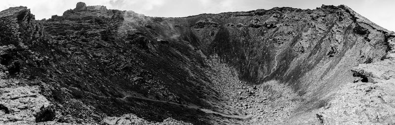 Rock formation on land against sky