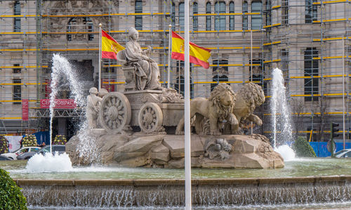 View of fountain against built structure