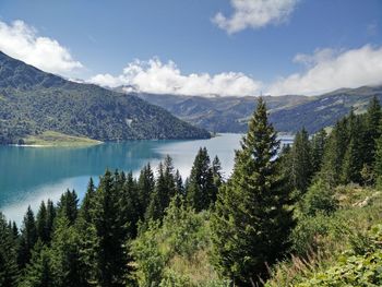 Scenic view of lake against cloudy sky