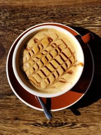 High angle view of coffee cup on table