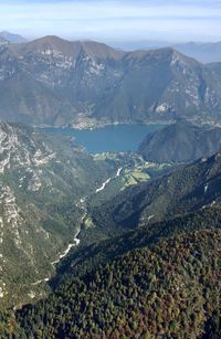 High angle view of valley and mountains against sky