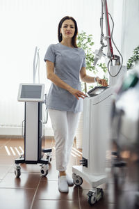 Portrait of young woman standing in gym