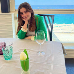 Portrait of woman sitting on table