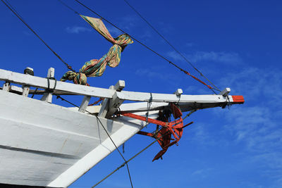 Low angle view of crane against sky