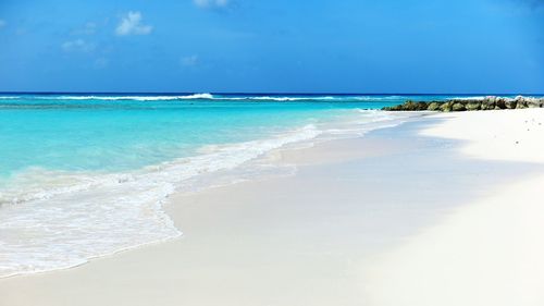 Scenic view of beach against sky