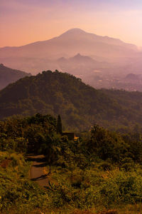 Scenic view of mountains against sky during sunset