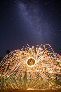 Low angle view of wire wool at night