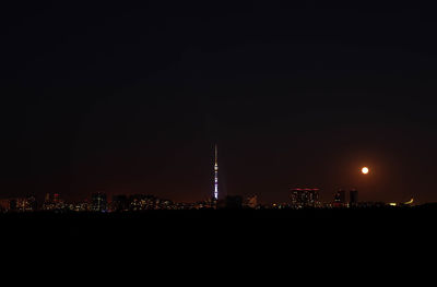 Illuminated buildings in city at night