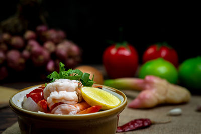 Close-up of fruits in bowl on table