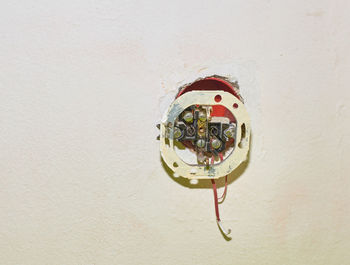 Close-up of electric lamp on wall