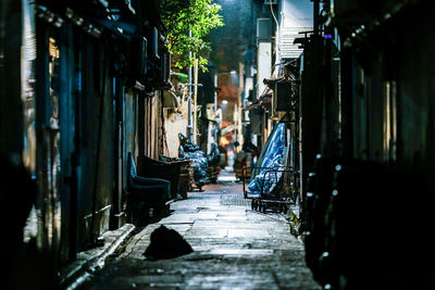 Narrow alley amidst buildings in city