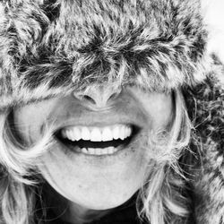 Close-up of woman wearing ushanka laughing