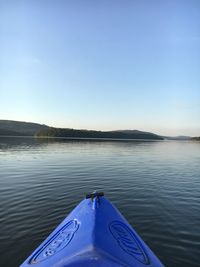 Scenic view of lake against clear blue sky