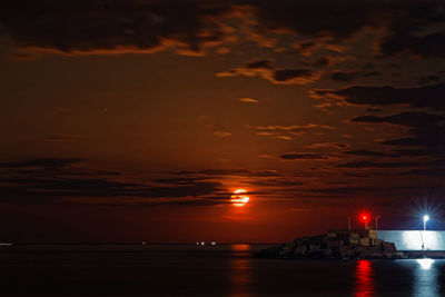 Scenic view of sea against sky during moon rise