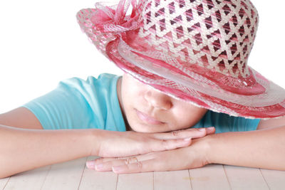 Close-up portrait of cute girl wearing hat