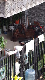 Close-up of clothes hanging on railing by building