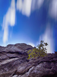 Low angle view of rocky mountain range against sky