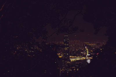 High angle view of illuminated buildings in city at night