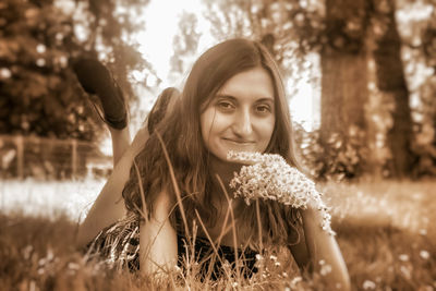 Portrait of smiling young woman outdoors