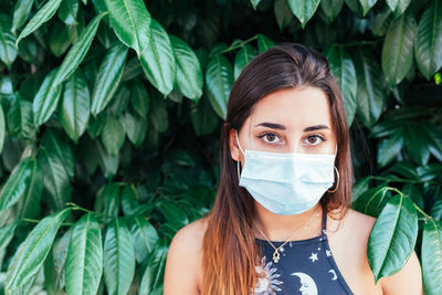 Portrait of a beautiful teenager with a medical mask