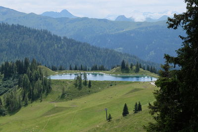 Scenic view of landscape and mountains against sky