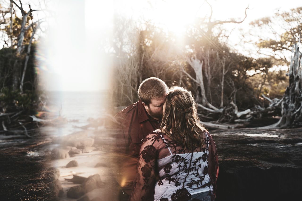 two people, togetherness, bonding, love, women, positive emotion, emotion, adult, real people, men, nature, tree, females, sunlight, lifestyles, leisure activity, day, males, people, water, couple - relationship, lens flare, outdoors