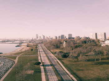 Aerial view of city against clear sky