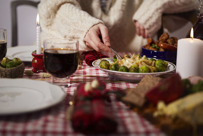 Mid section of woman at christmas table