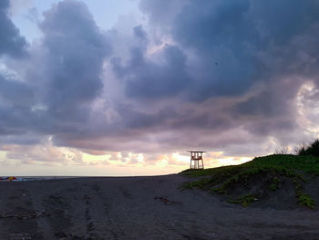 Scenic view of beach against sky during sunset