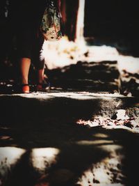 Low section of woman standing on floor