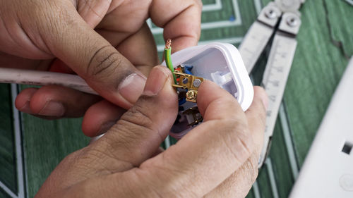 Close-up of man holding hands