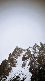 Scenic view of snow covered mountain against clear sky