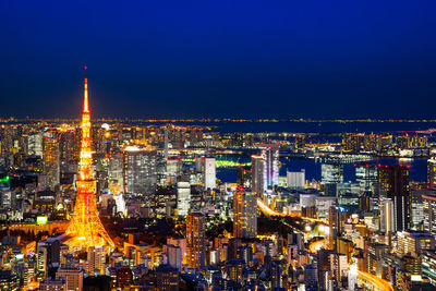 High angle view of illuminated city buildings at night