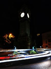 High angle view of light trails on road at night