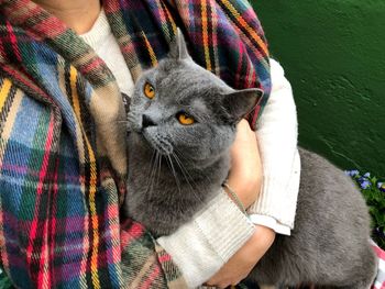 Close-up portrait of man with cat