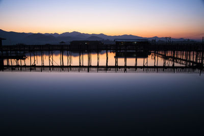 Scenic view of river at sunset