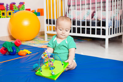 Boy playing with toy toys